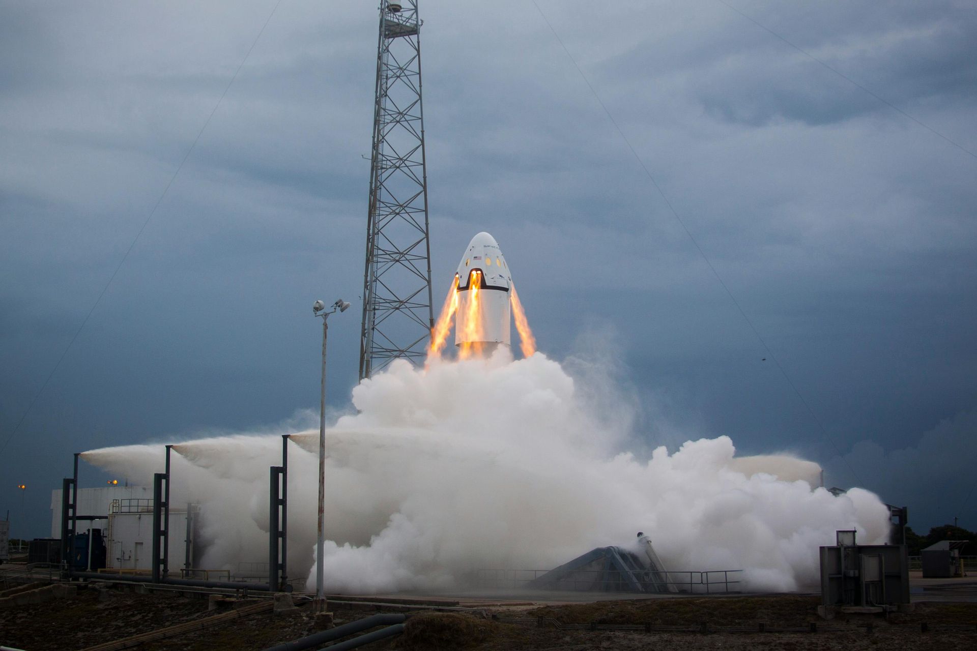 A rocket is being launched into space with smoke coming out of it.