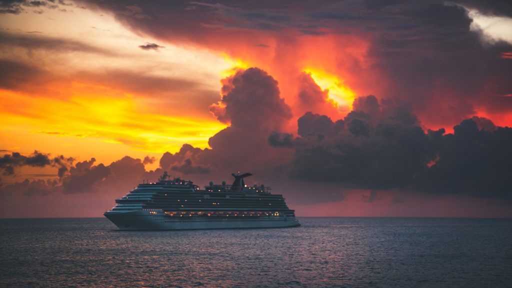 There are two candles and a shofar on the table.