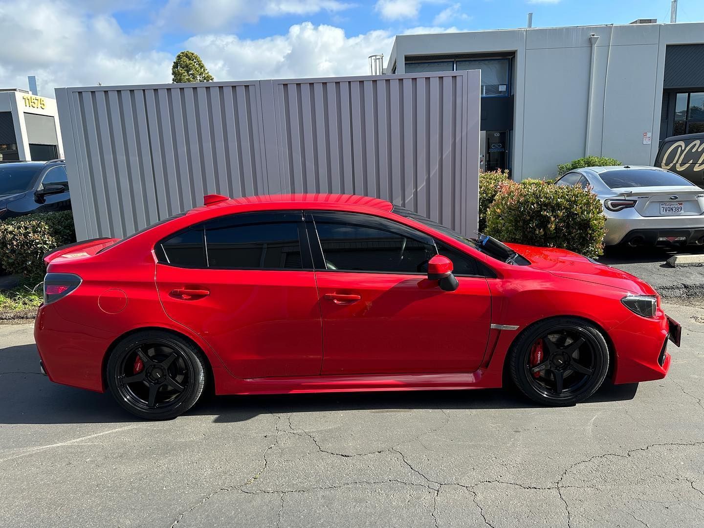  A car parked under sunlight with deep-tinted windows for maximum UV defense.
