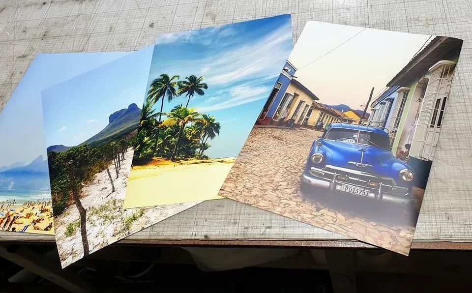 Three Pictures on a Table Including One of a Blue Car — Fresh Print Signs in Murwillumbah, NSW
