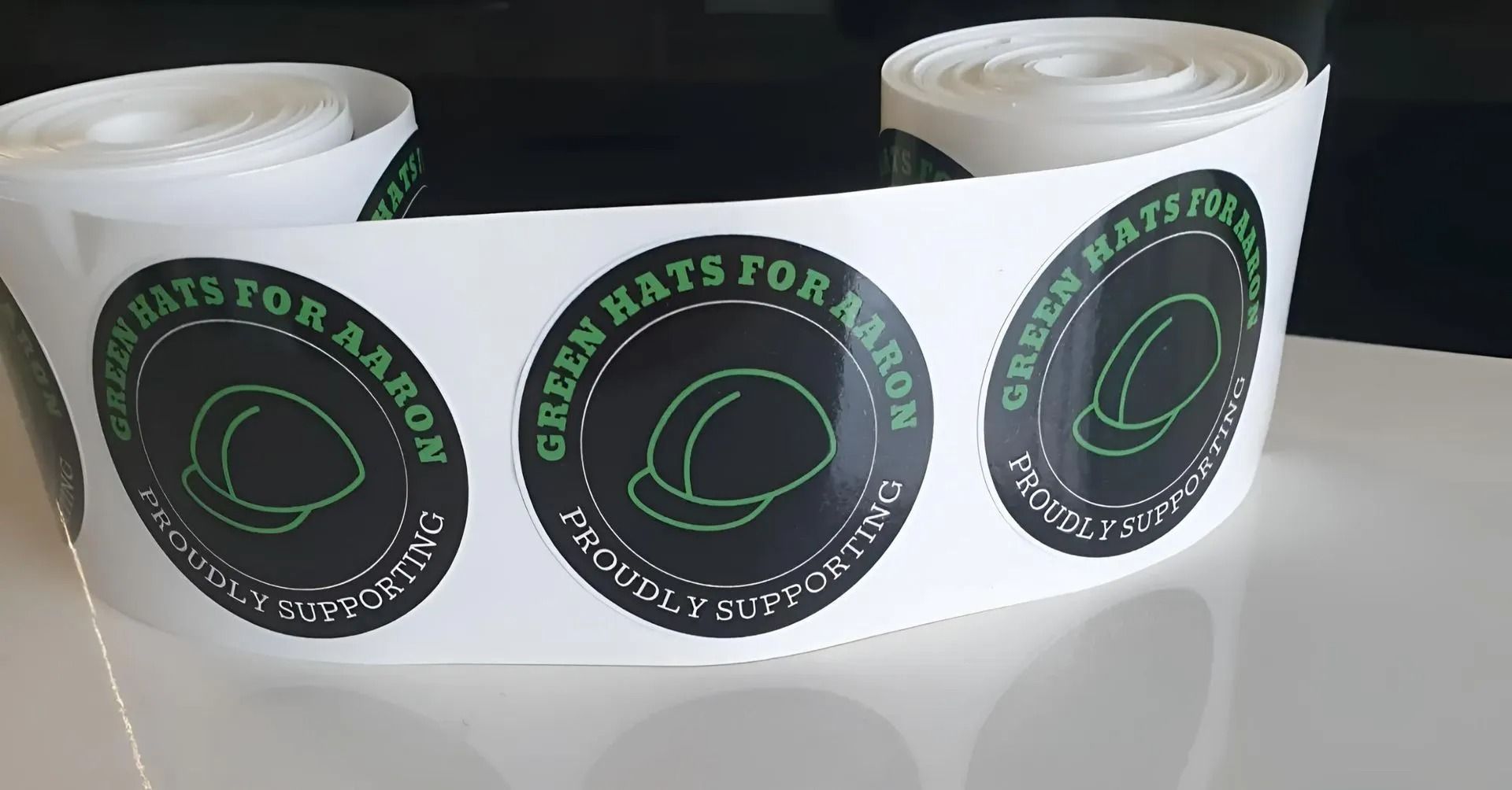 A Roll of Stickers That Say Green Hats for Armor — Fresh Print Signs in Murwillumbah, NSW