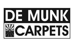 Een zwart-wit logo voor de munk carpets.