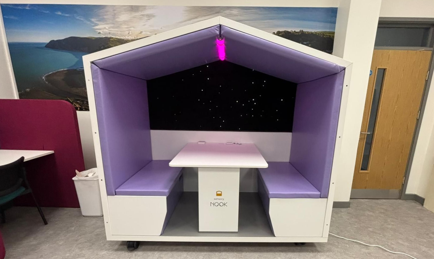 Sensory Nook Support with pink rgbw lighting and bench seating in a school setting