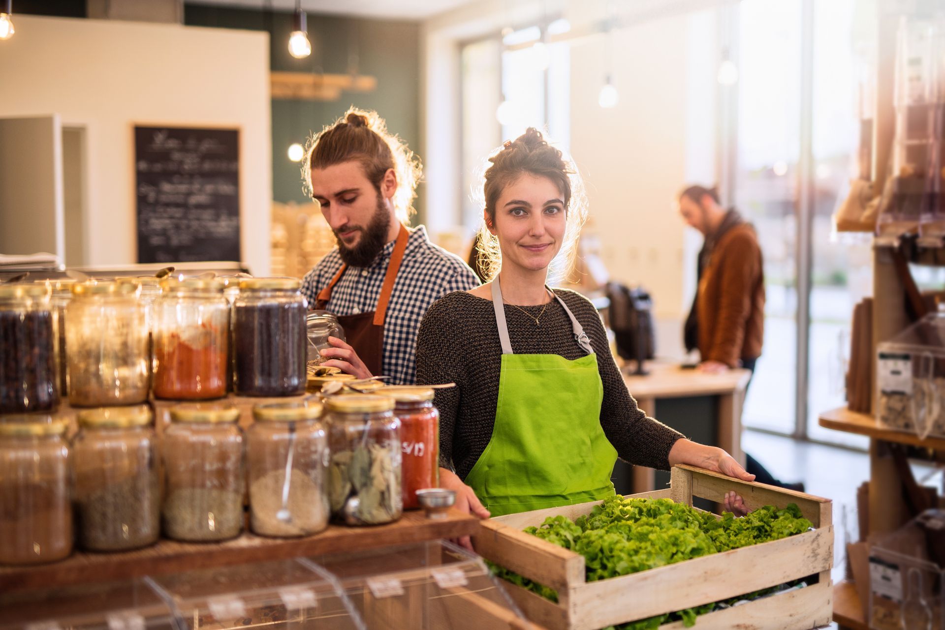 Couple working in a bulk food store. Couple working in a bulk food store.