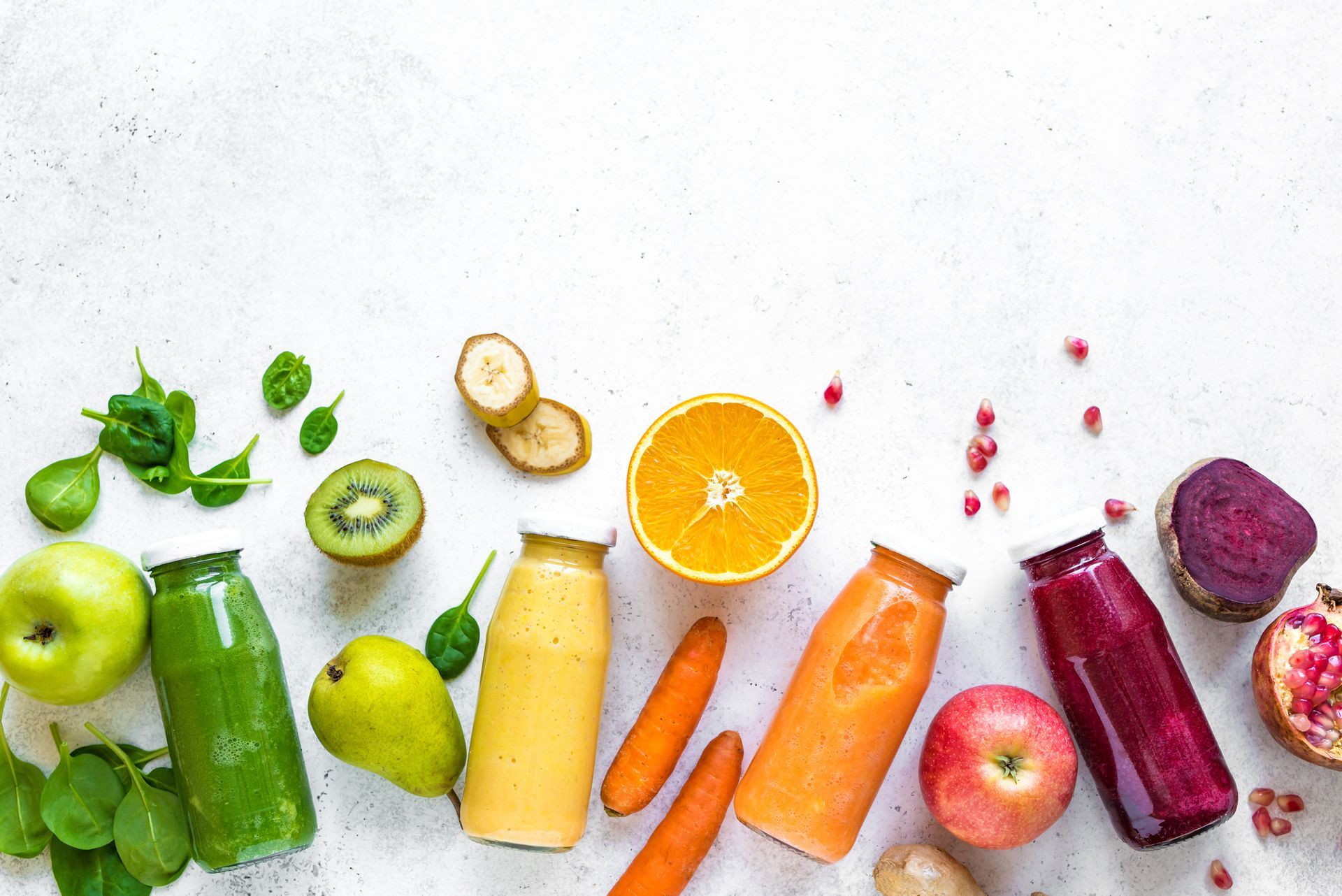 Bottles of juice and fruits