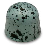 A green chocolate candy with black spots on it on a white background.