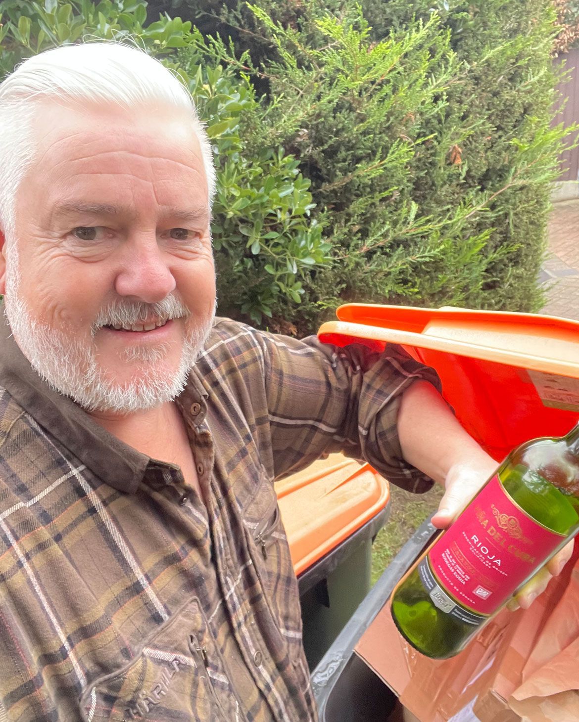 Glass recycling starts 1 Dec 2025. Photo of Charles Royden recycling glass 