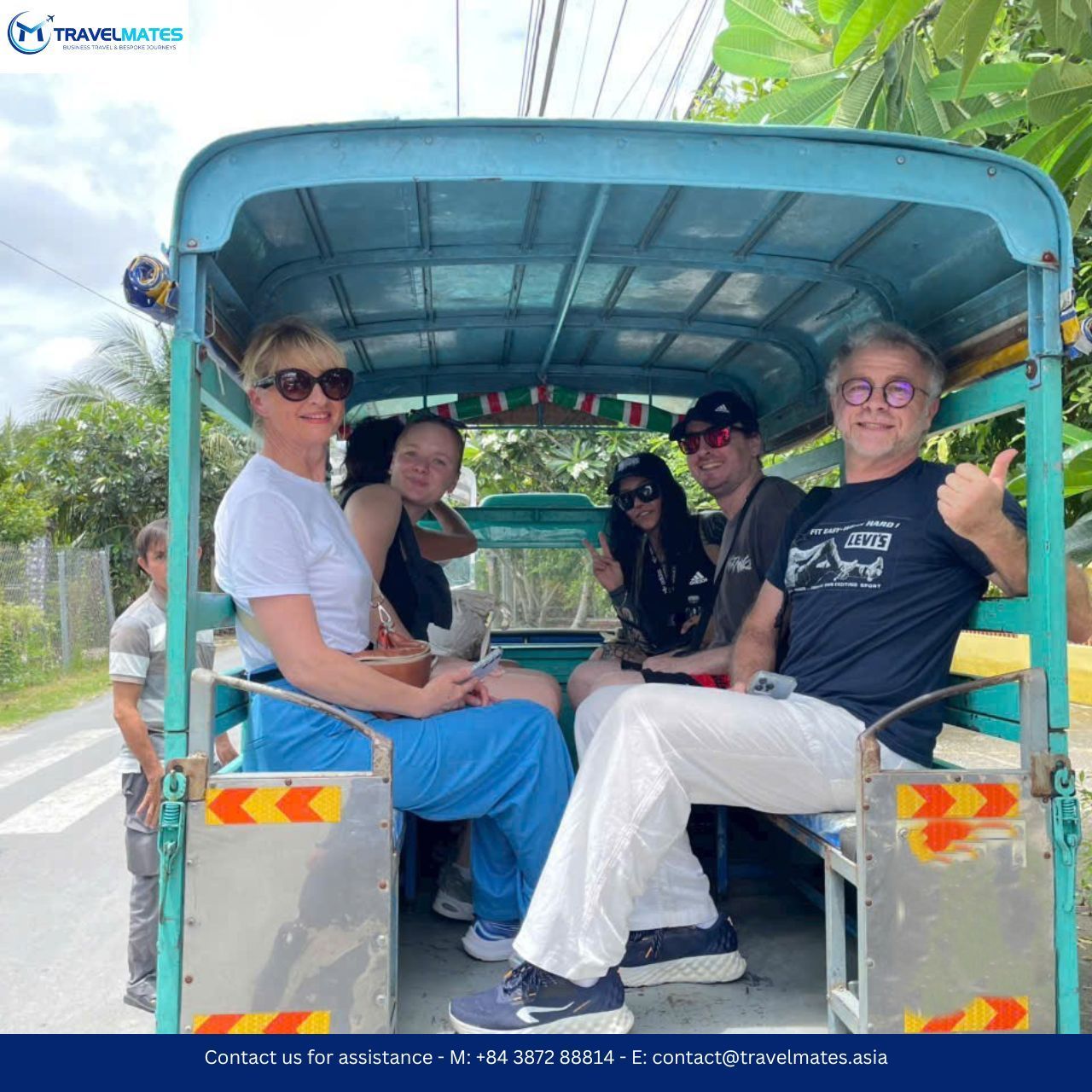 Visitors enjoying a local tuk tuk ride in Mekong Delta tour