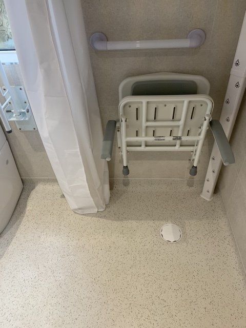 mobility bathroom with folded seat