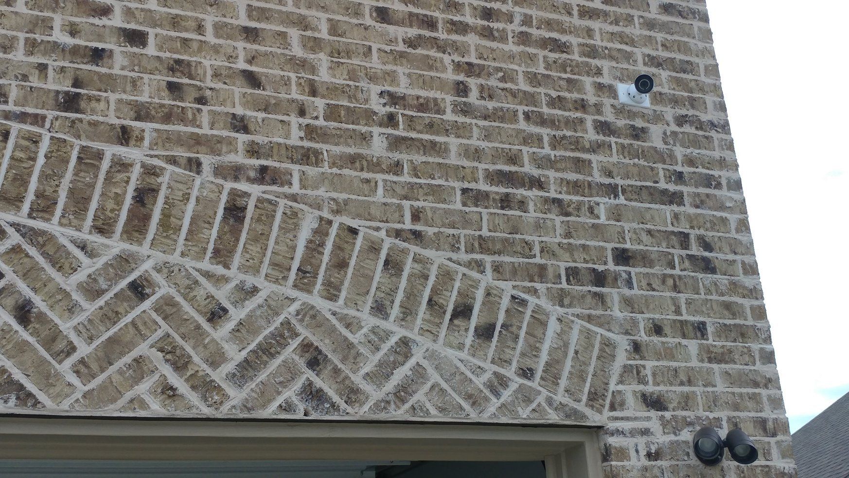 MICRO BULLET ABOVE GARAGE ENTRY