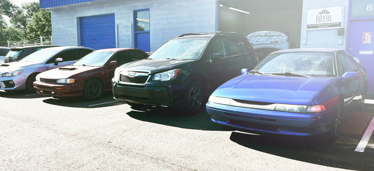 A line of cars parked outside a building. | Royal Automotive Repair