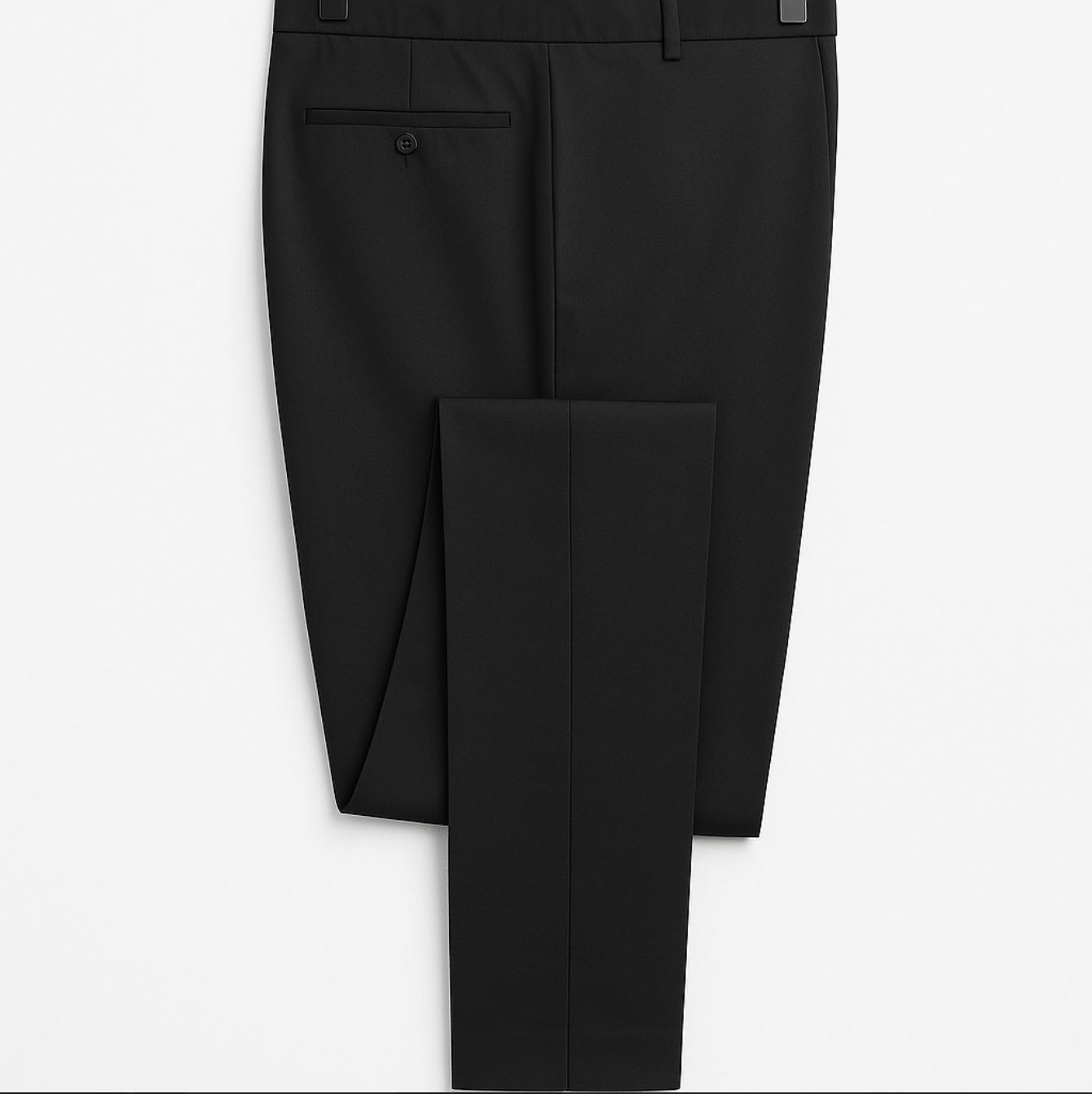 A black tuxedo jacket is hanging on a hanger