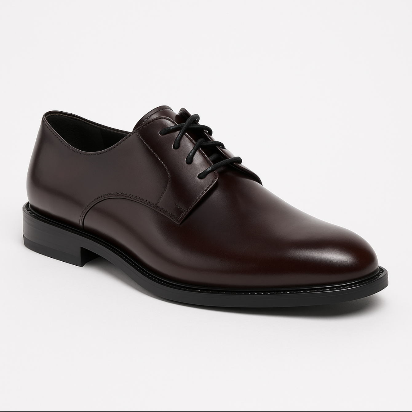 A pair of brown shoes with black laces on a white background