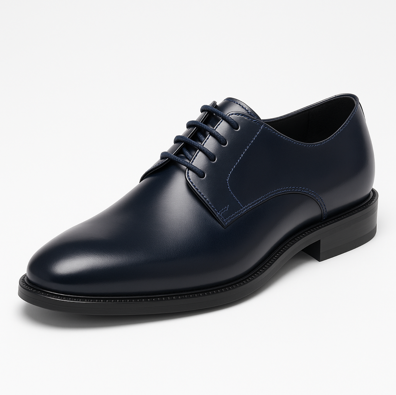 A pair of blue shoes with black laces on a white background