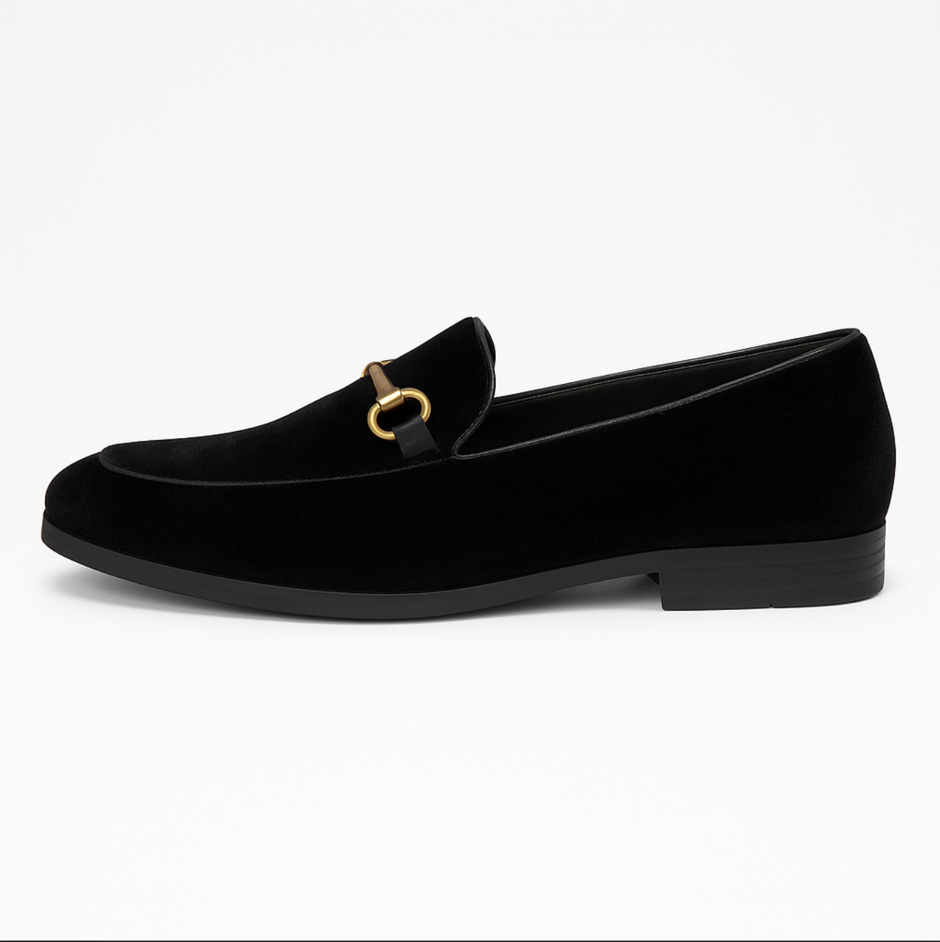 A pair of black velvet loafers with a gold buckle on a white background.