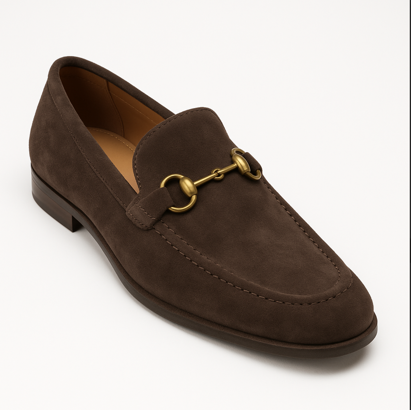 A pair of brown loafers with a gold buckle
