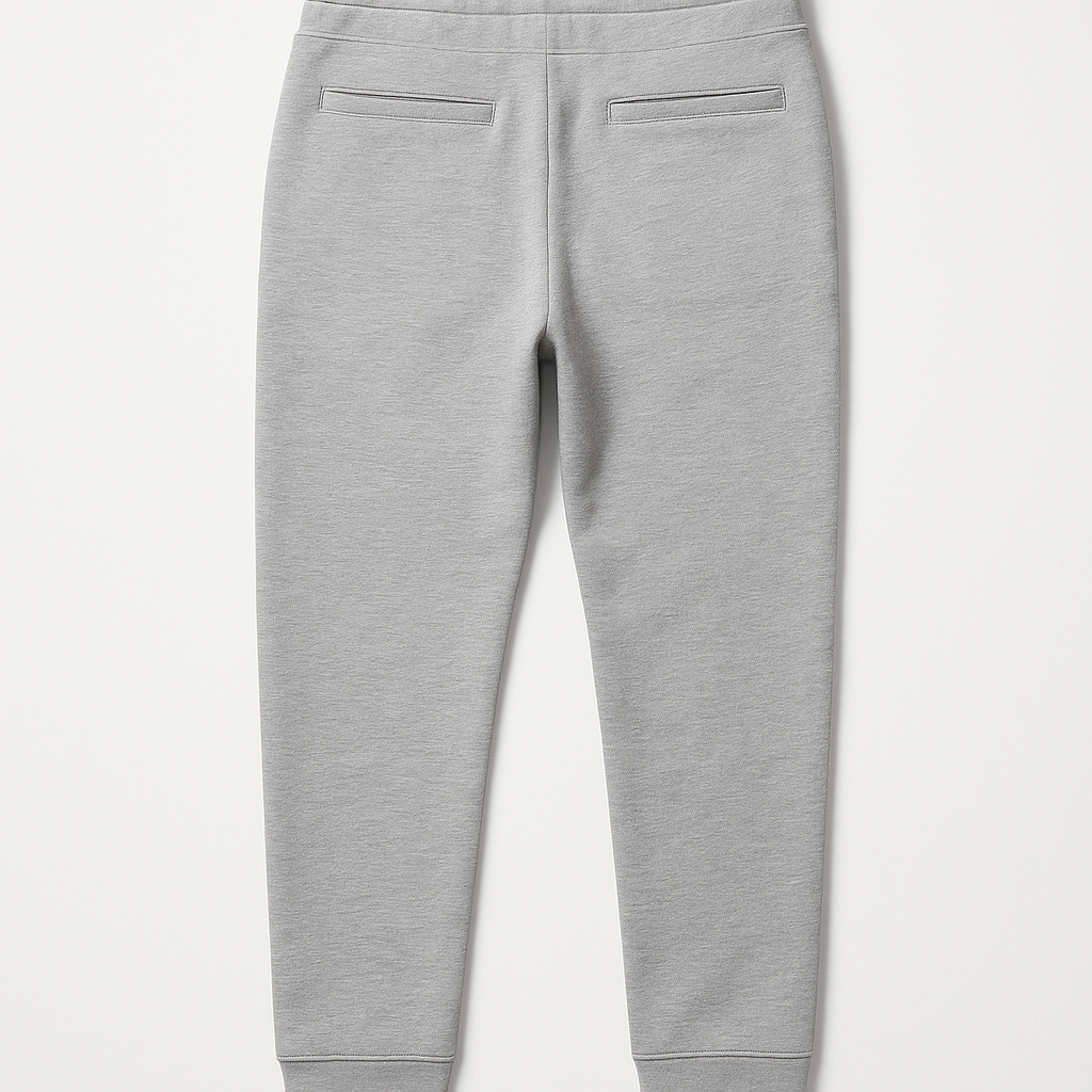 A pair of grey sweatpants with a drawstring waist on a white background.