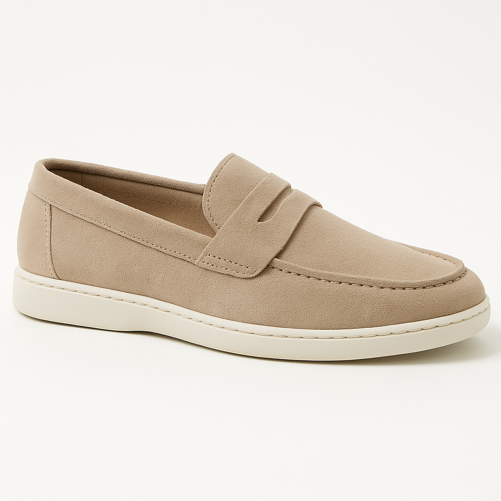 A pair of tan loafers with a white sole on a white background.
