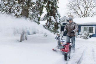 Man clearing driveway with snowblower - Lawn & Garden Equipment and Supplies in Twin Falls ID