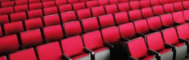 Installation of red Convention theater seats