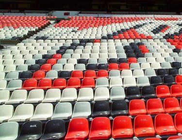 An installation of multicolor Giovanni stadium chair shells