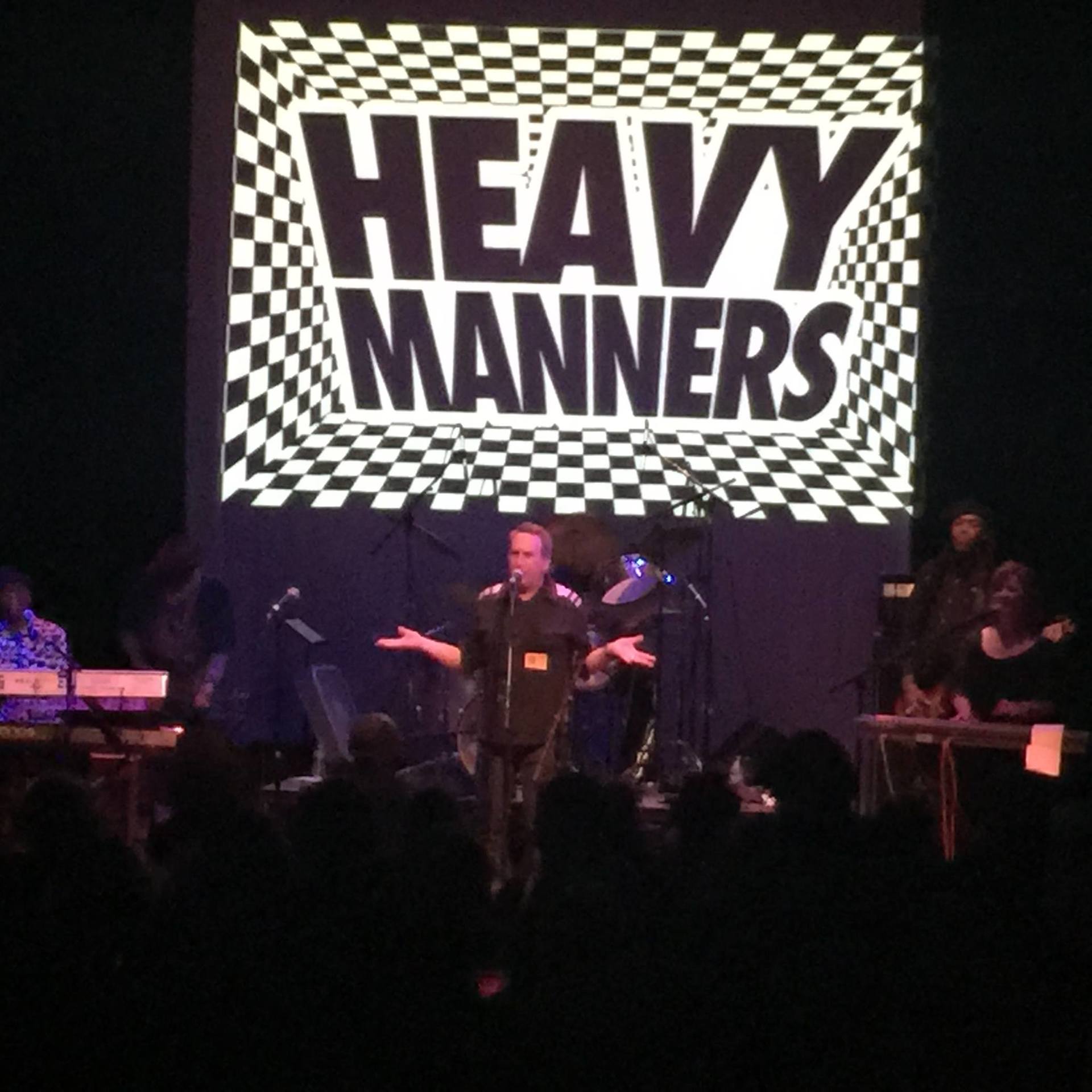 Heavy manners is the name of the band on the stage