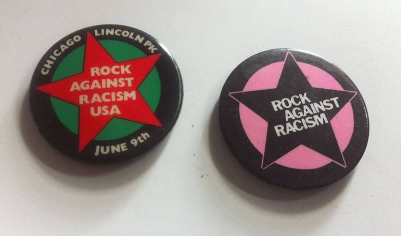 Two buttons that say rock against racism on them