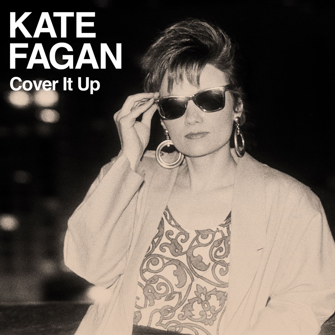 A black and white photo of a woman wearing sunglasses by kate fagan