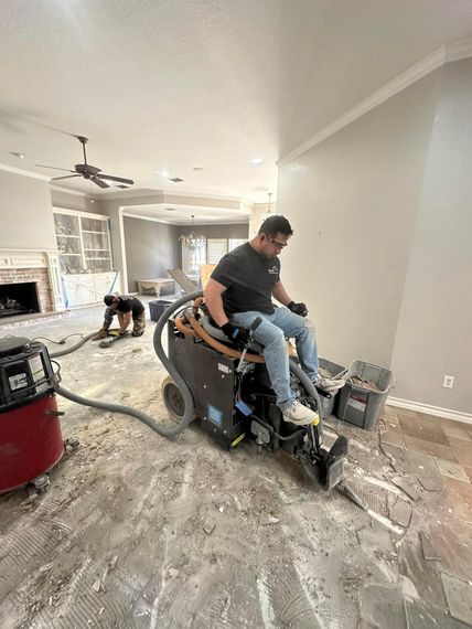 Picture is showing tile and thinset removal. Equipment being used is for dust control during tile and thinset removal. Hepa vacuum, rise on floor scraper, and a grinder. 