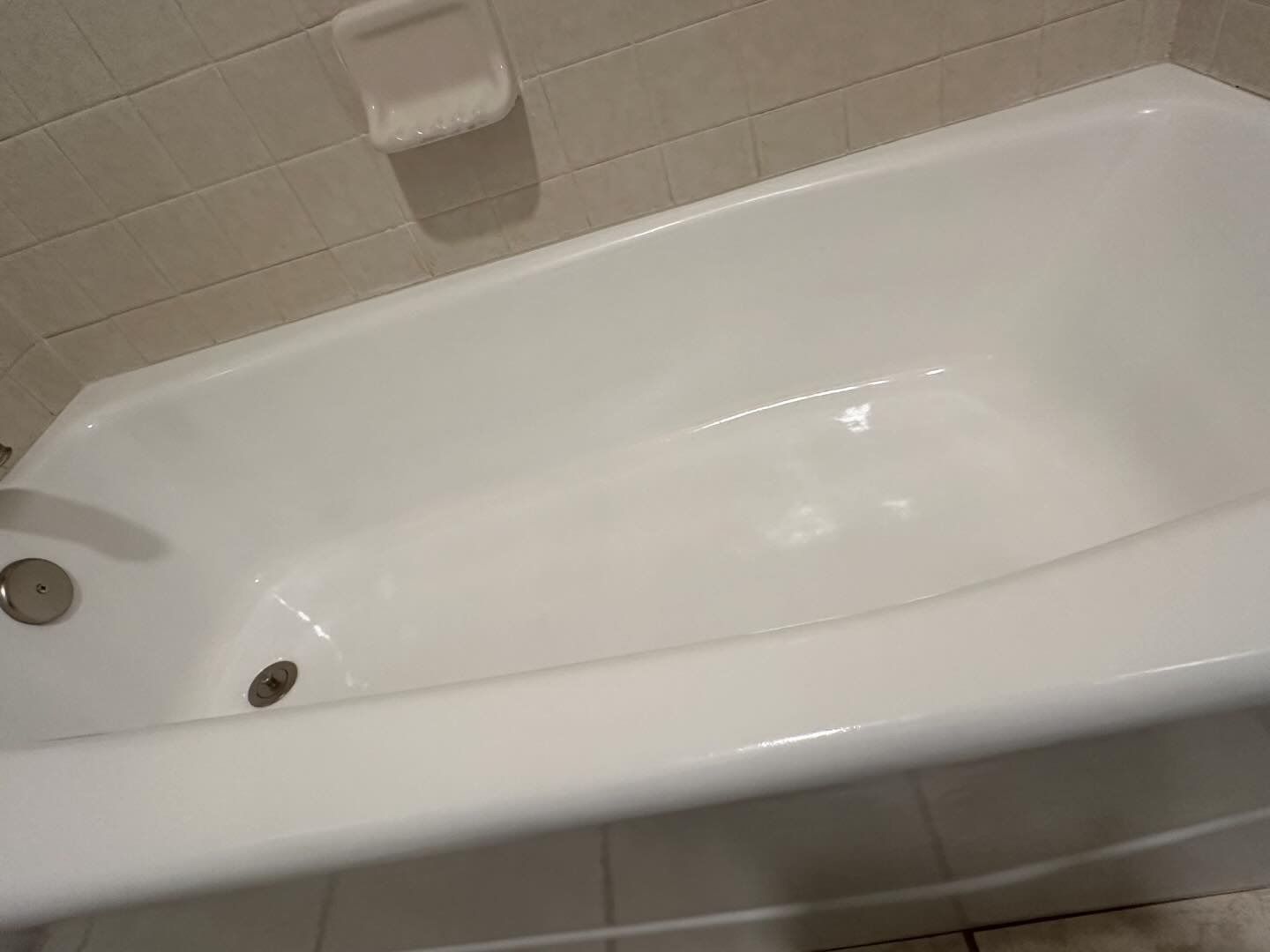 This bathtub transformed from old and dirty, with soap scum, rust spots, and signs of wear. Re-Nu's bathtub refinishing service restored it to a like-new condition.