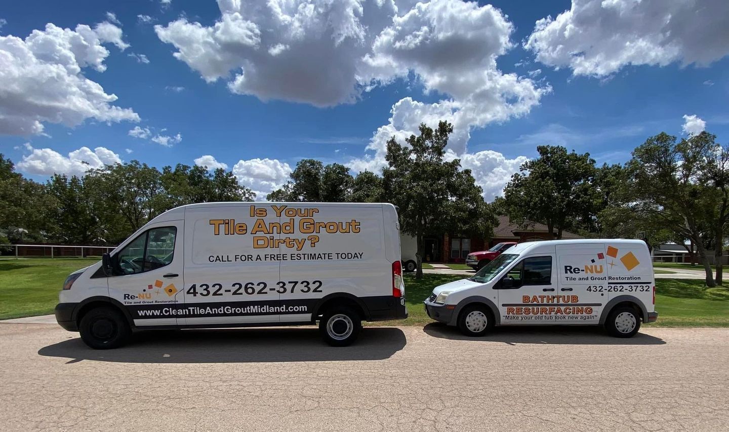 This image is of the two vans owned by Re-Nu Tile and Grout Restoration. Bathtub refinishing equipment and a steam cleaning machine used by tile and grout cleaning companies. 