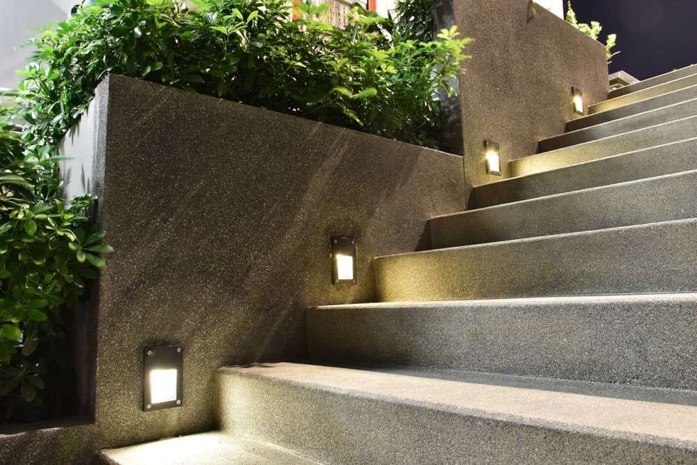 Outdoor Concrete Staircase at Night With Illuminated Wall — CH Electrics in Emerald, QLD