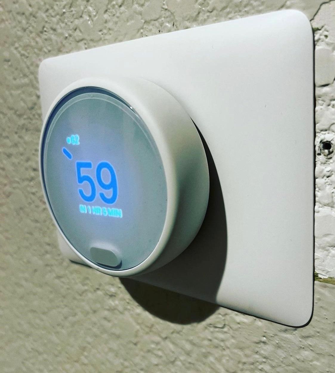 A thermostat that has the number 59 on it
