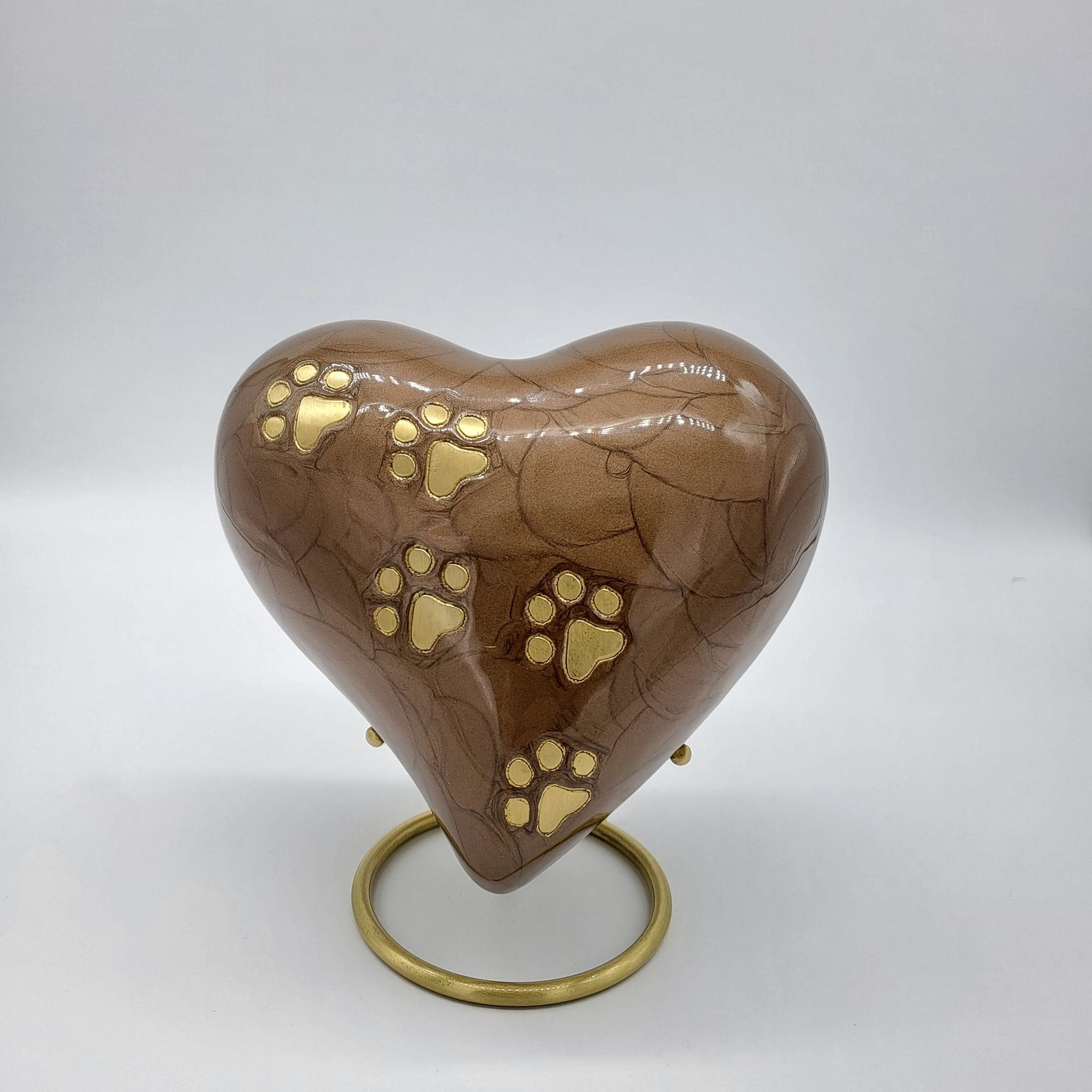 Heart-shaped Urn With Golden Paw Prints, on a Gold Stand. Brown, Cracked Finish — Furever Pet Cremations in Gladstone, QLD