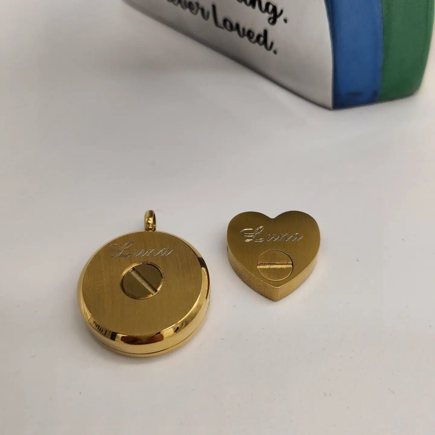 Gold Circular and Heart-shaped Pendants With Screw Closure — Furever Pet Cremations in Rockhampton, QLD