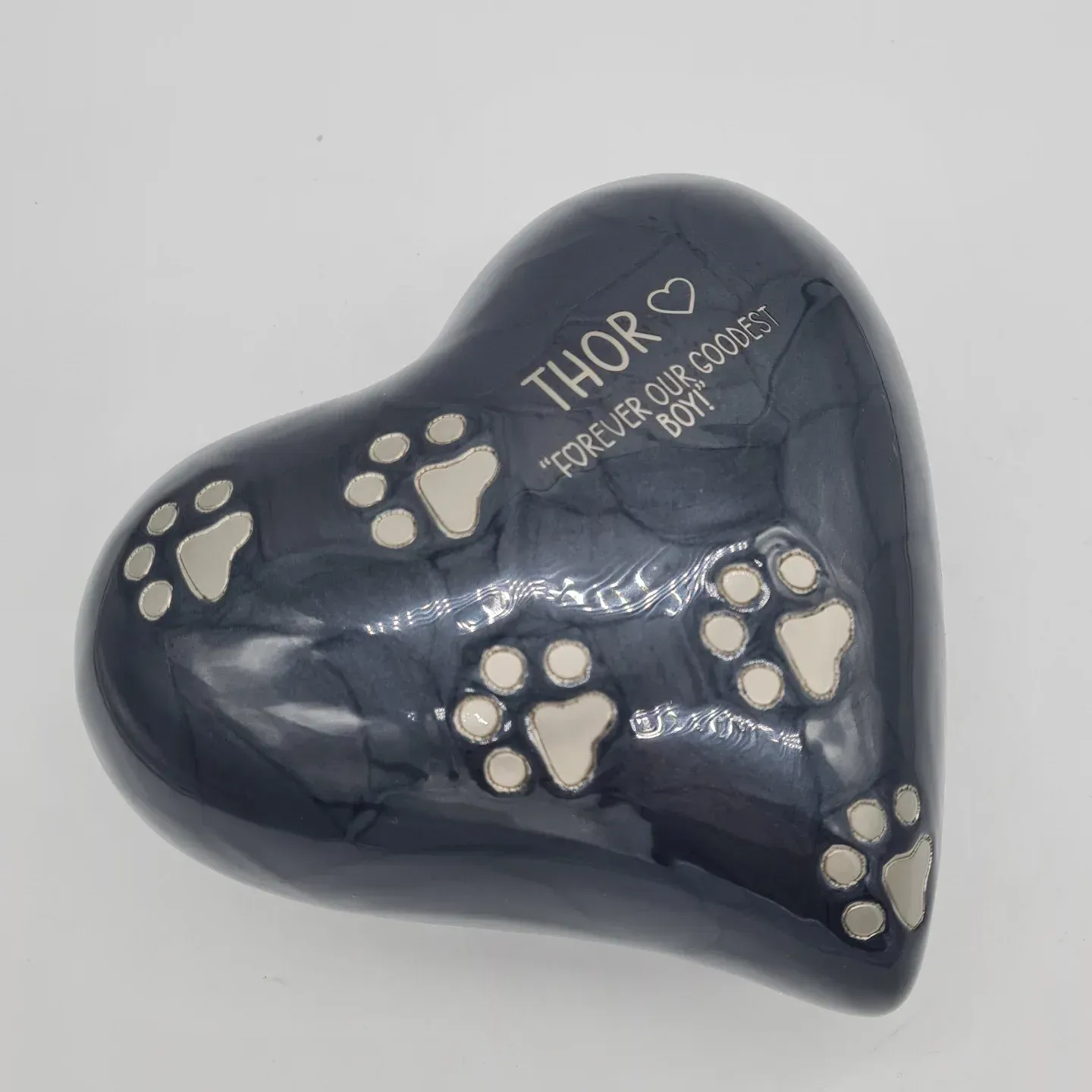 Heart-shaped, Charcoal-coloured Pet Urn With Silver Paw Prints — Furever Pet Cremations in Yeppoon, QLD