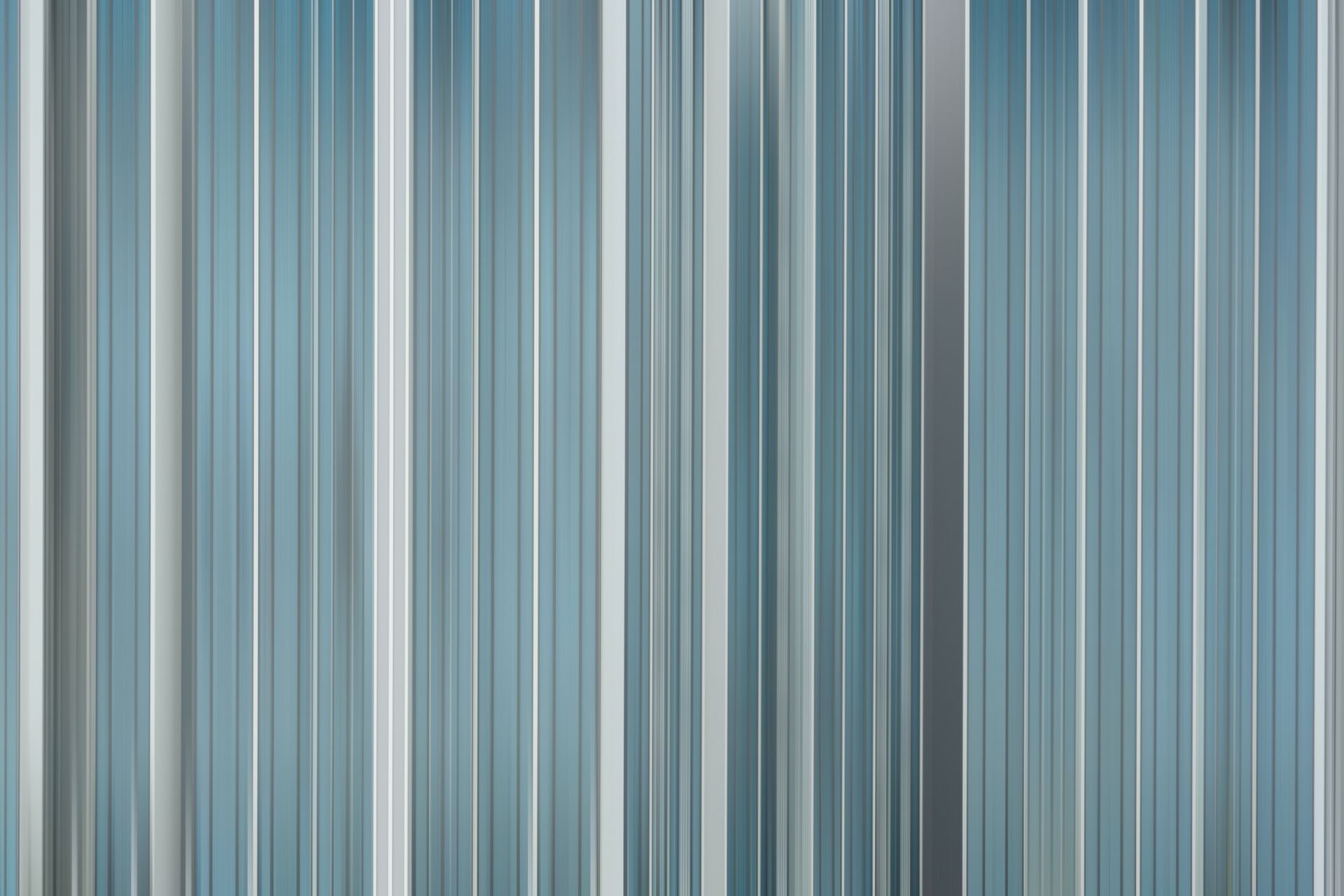 A close up of a blue and white striped wall.