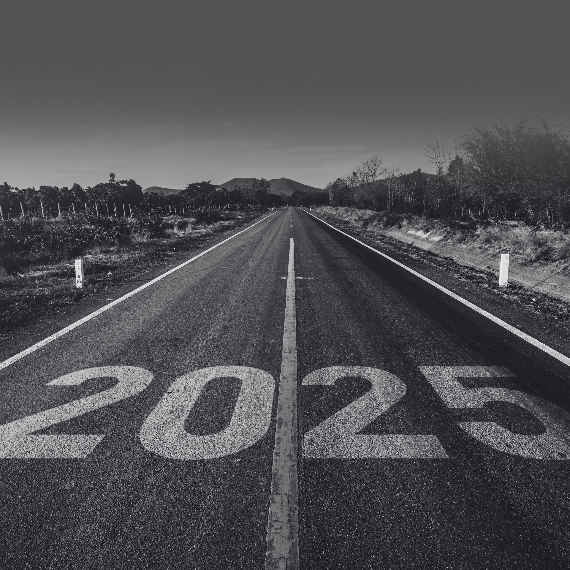 2025 written on an empty highway, symbolizing the future of Small Fleet Occupational Accident.