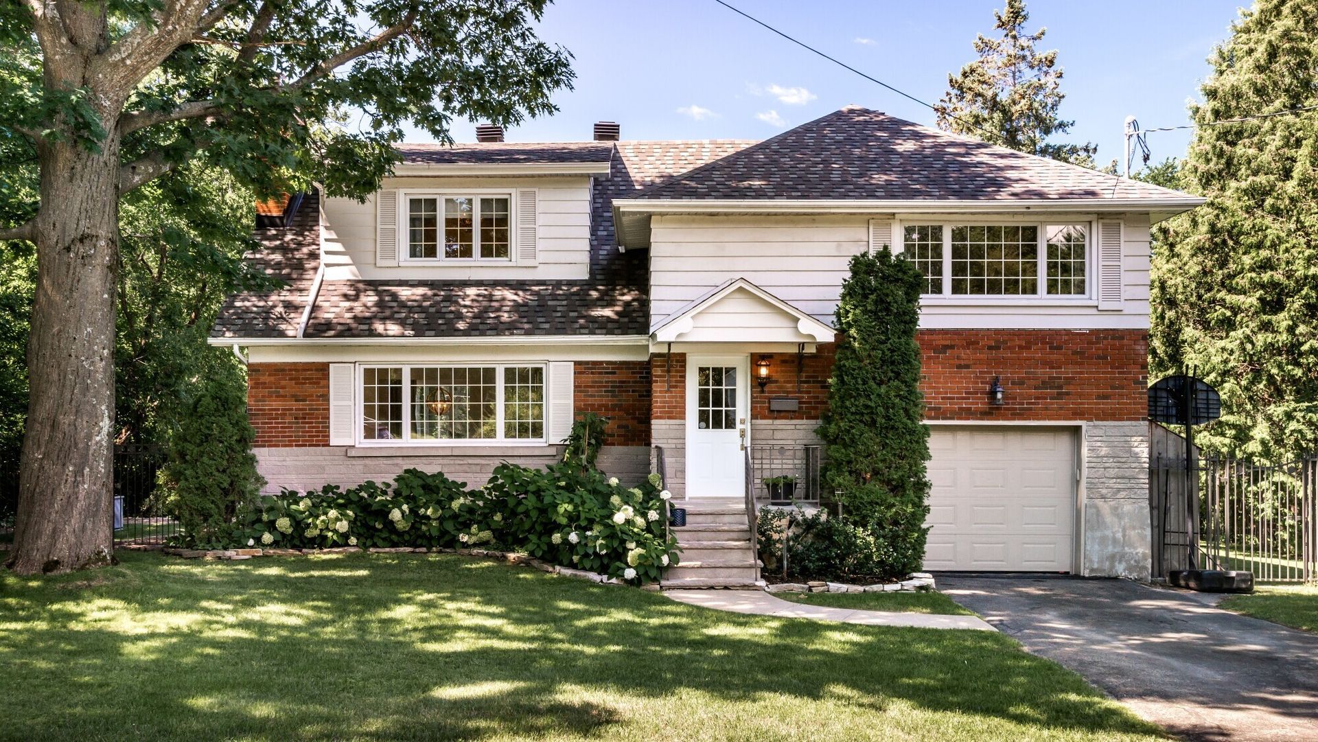 A large brick house with a white garage door
