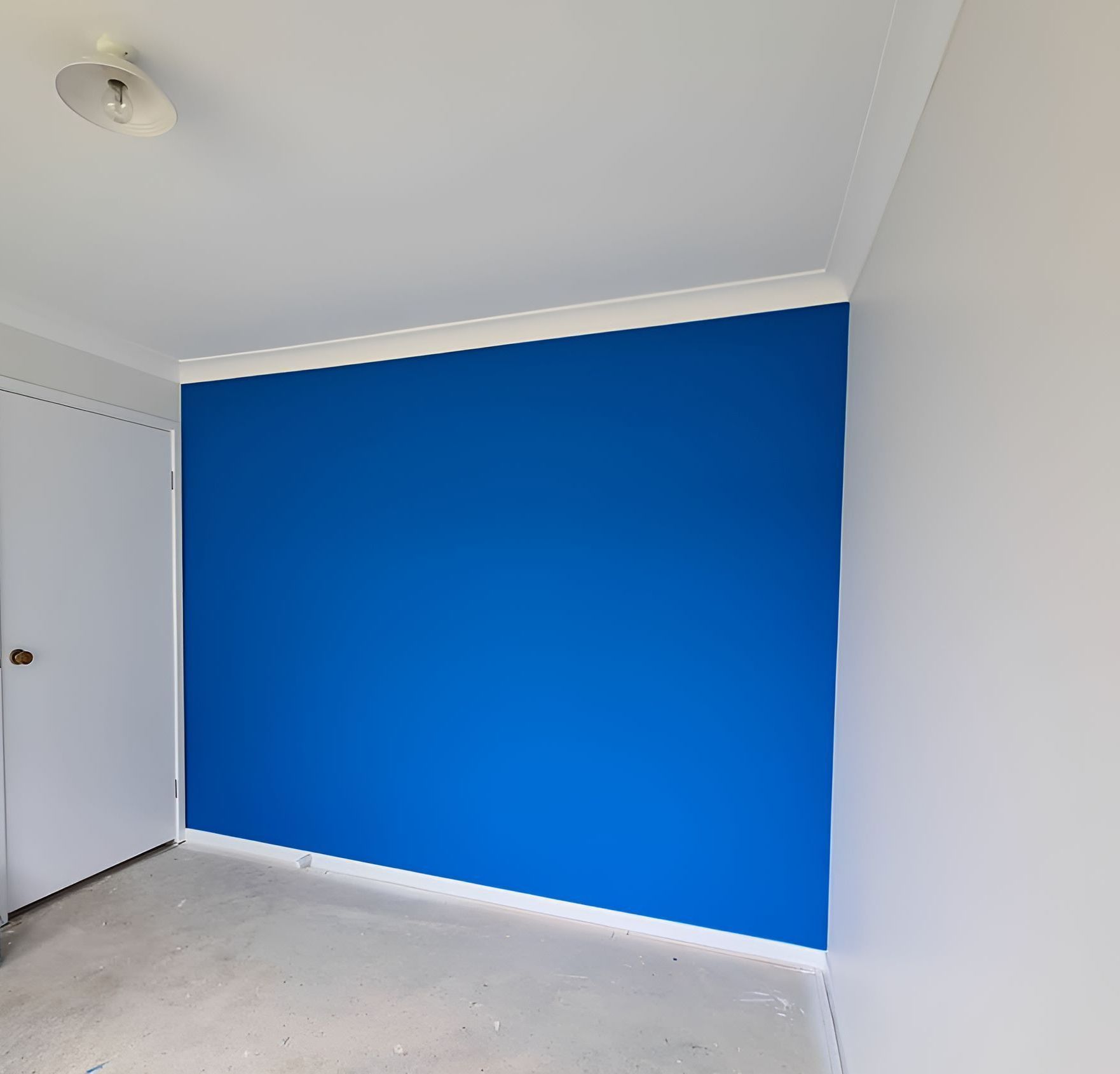 A Room With a Blue Wall and White Walls — JAX Painting Services in Central Coast, NSW