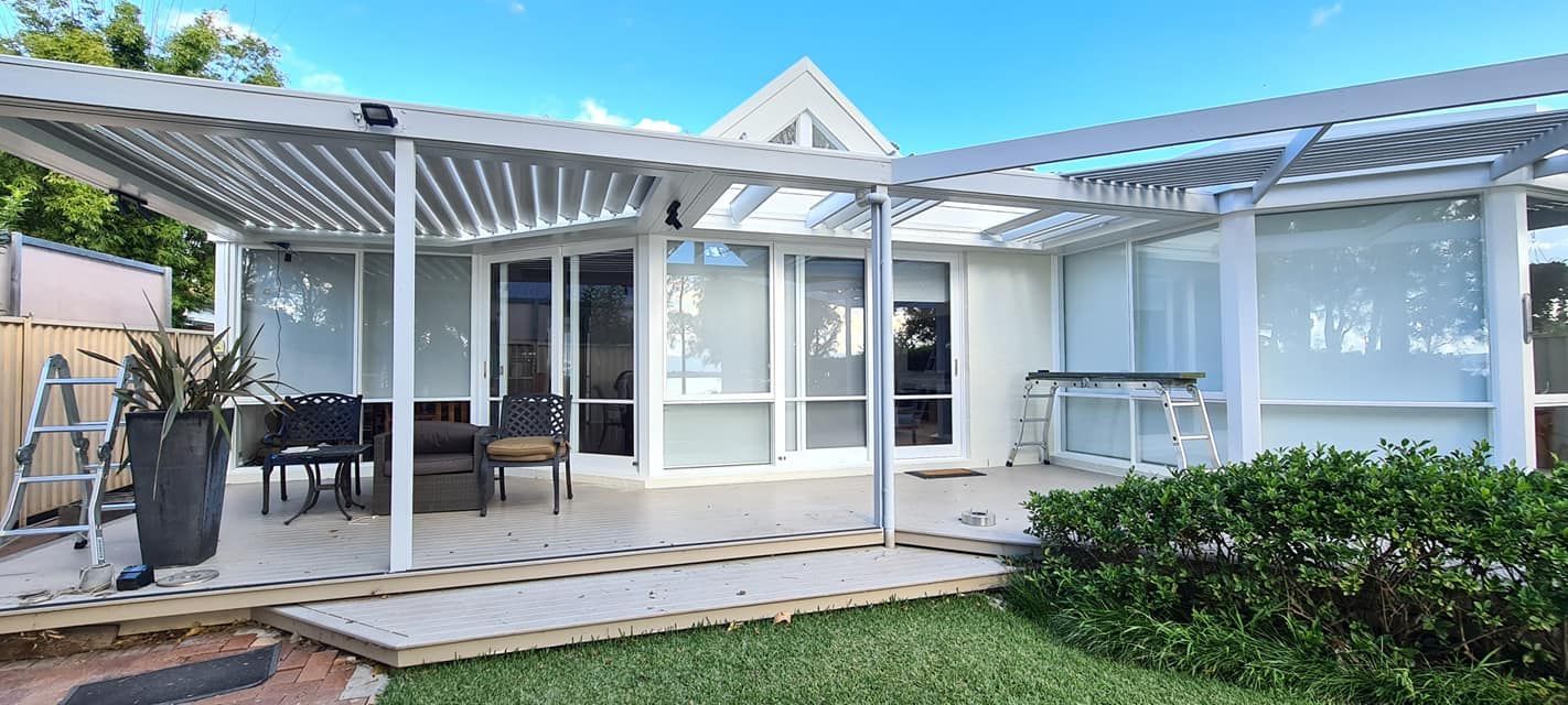 A White House With a Pergola in the Backyard — JAX Painting Services in Central Coast, NSW