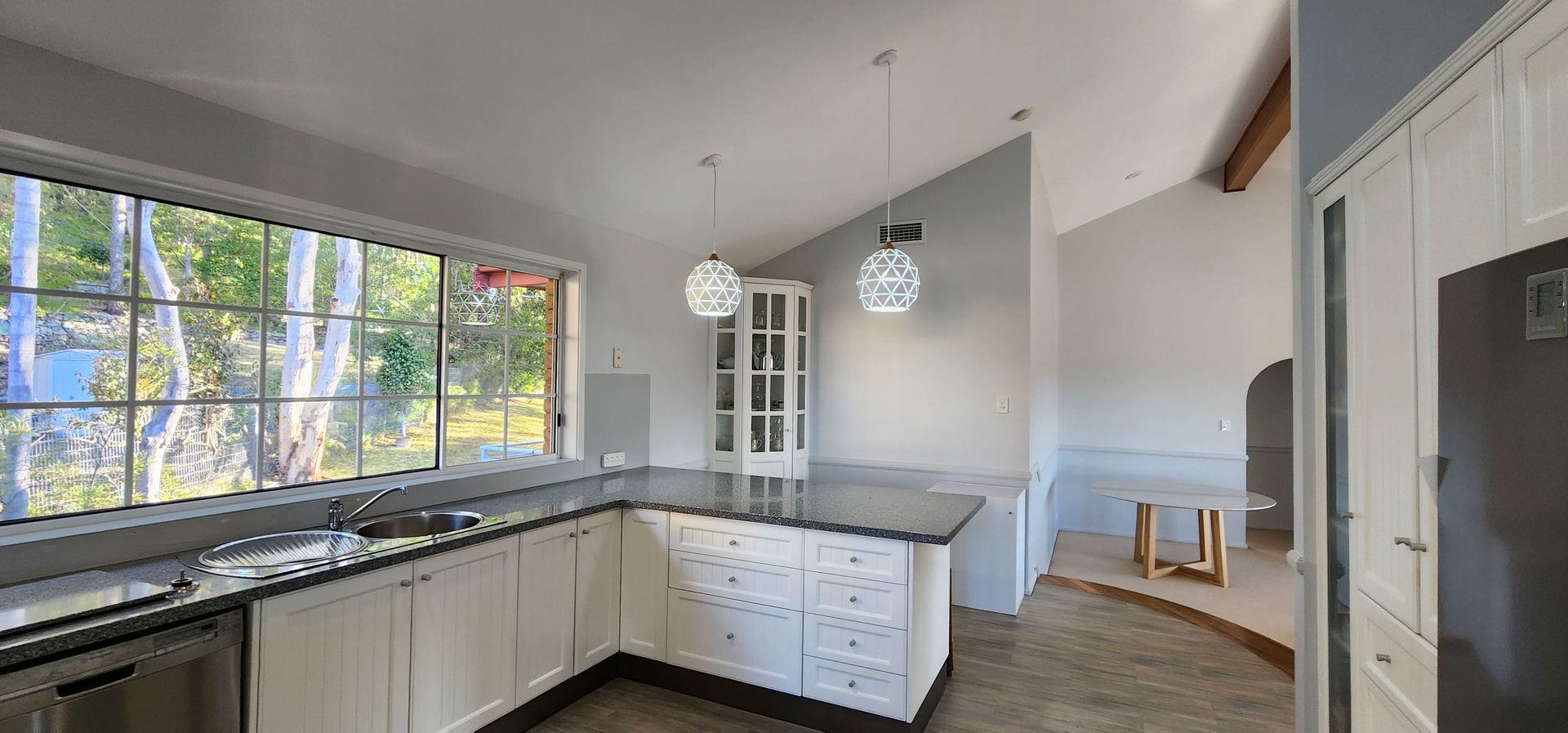 A Kitchen With a Large Island in the Middle and a Lot of Windows — JAX Painting Services in Central Coast, NSW