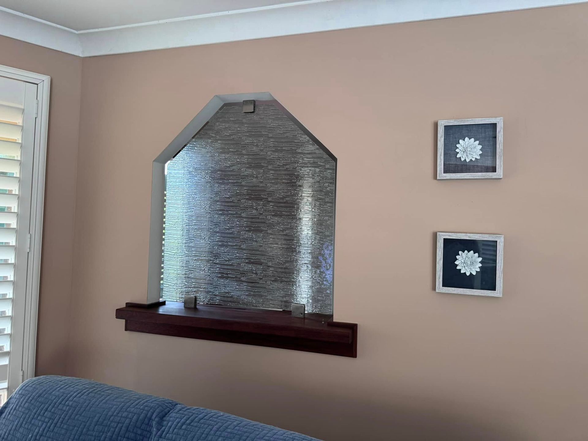 A Living Room With a Couch and Two Pictures on the Wall — JAX Painting Services in Central Coast, NSW