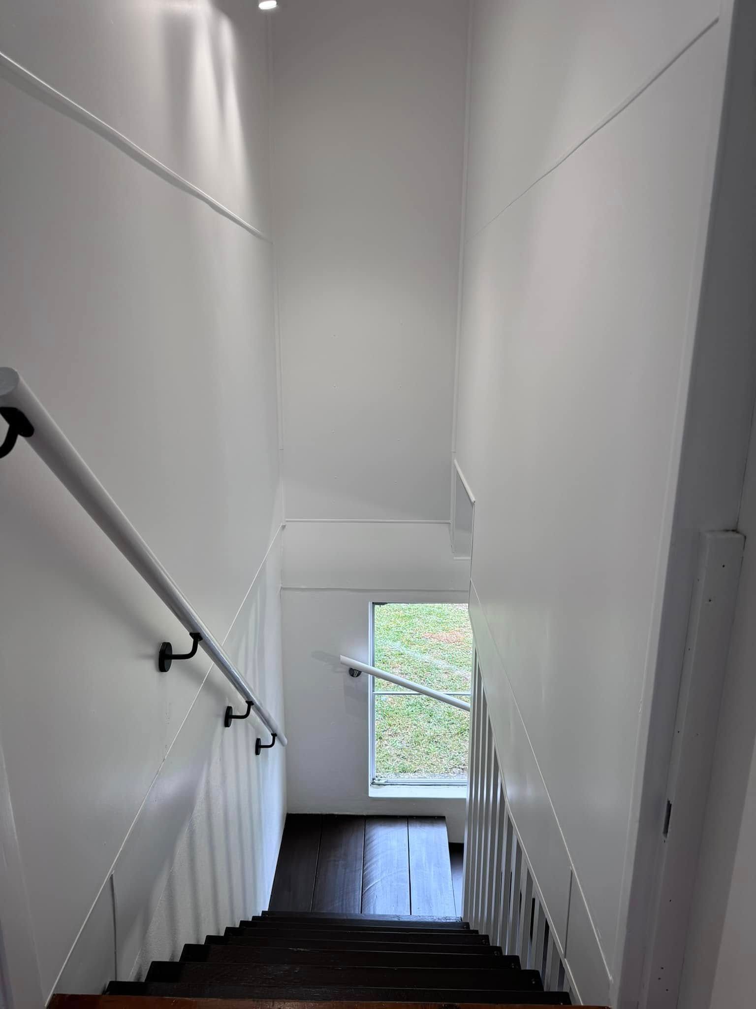 A Set of Stairs Leading Up to the Second Floor of a Building — JAX Painting Services in Central Coast, NSW