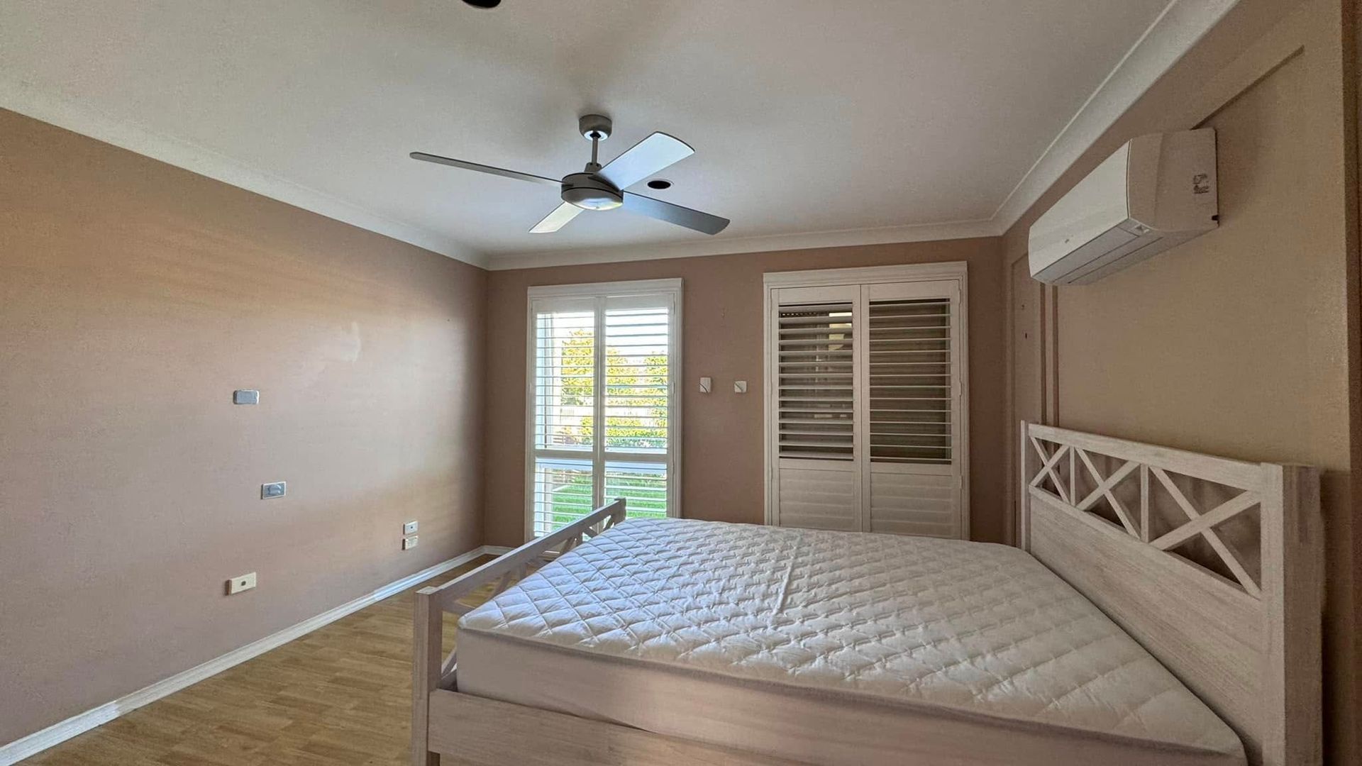 A house with a pergola and a ladder in the backyard — JAX Painting Services in Central Coast, NSW