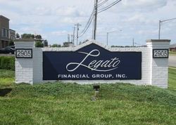 Leafo Financial Group, Inc. sign on a white brick monument by a roadside. Leafo Financial Group, Inc. sign on a white brick monument by a roadside.