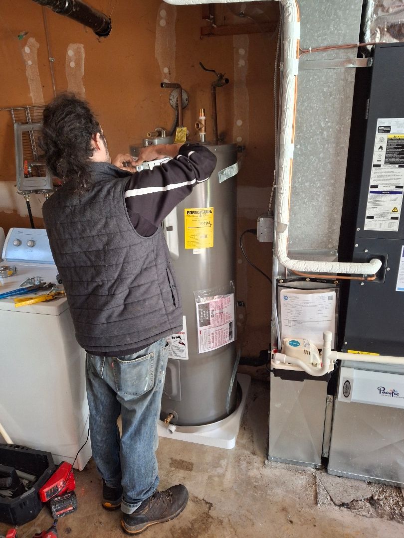 A Royal Flush Plumber installing a water heater