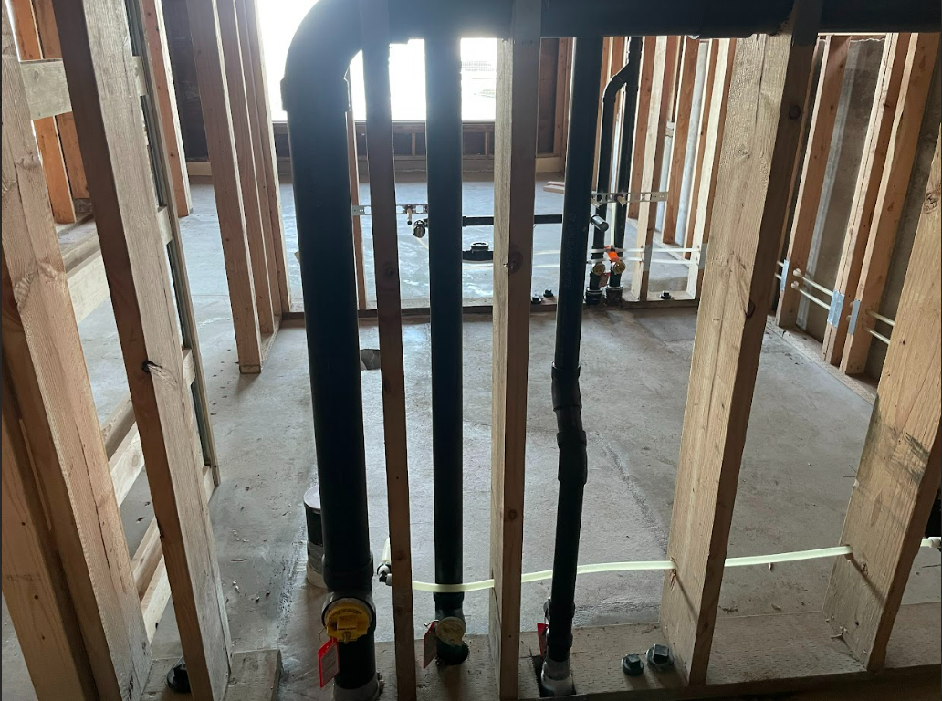 A room with a lot of pipes going through it.