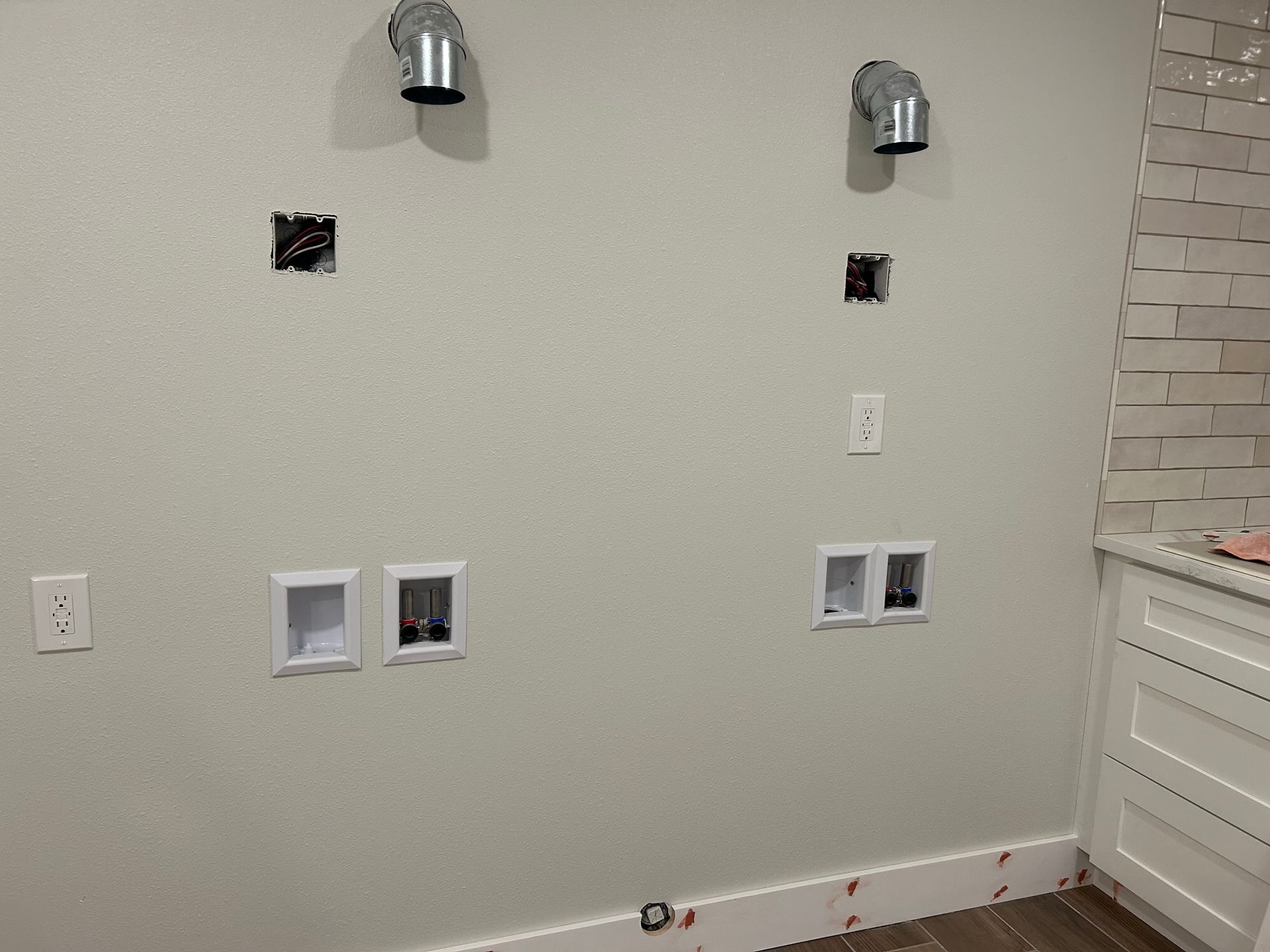 Two laundry room washing machine water supplies installed by Royal Flush Plumbing in Tacoma