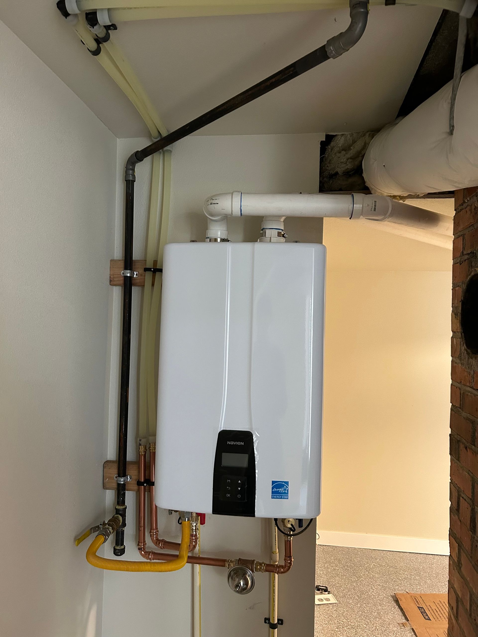 A tankless water heater installed by Royal Flush Plumbing in Tacoma